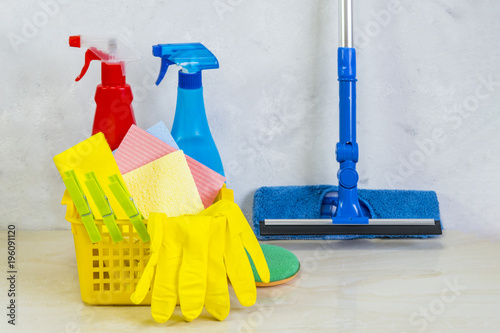 A cleaning kit with tools and products at home. photo