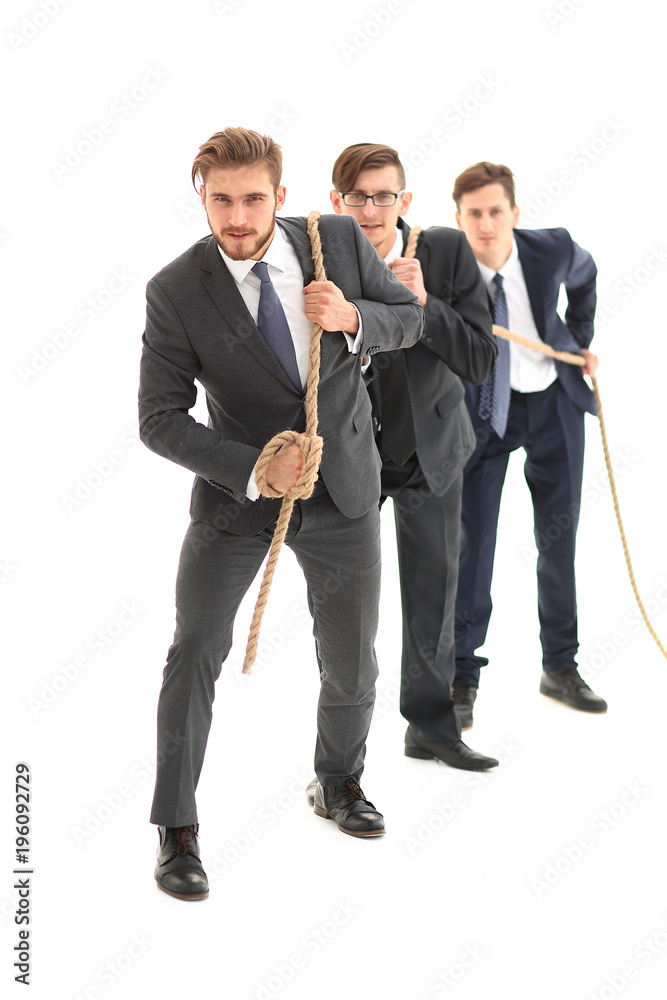 closeup.smiling business team pulls the rope.