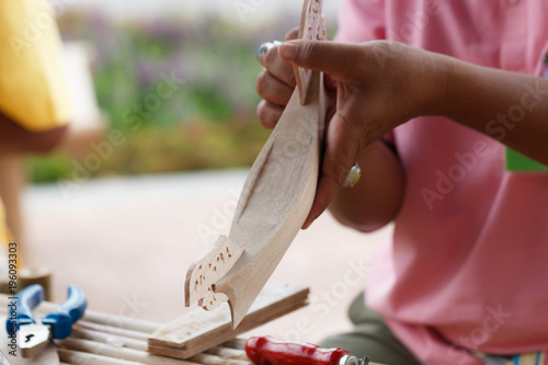 Traditional craftsman making wooden boat