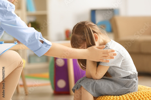 Female psychologist calming...