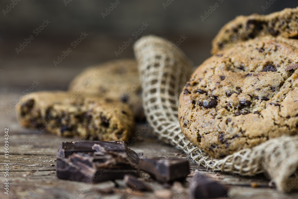 Freshly Baked Chocolate Cookies on Rustic Wooden Table. Sweet Biscuits. Homemade pastry. Freshly Baked Chocolate Cookies on Rustic Wooden Table. Sweet Biscuits. Homemade pastry.