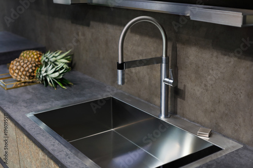 sink with a tap on a kitchen counter