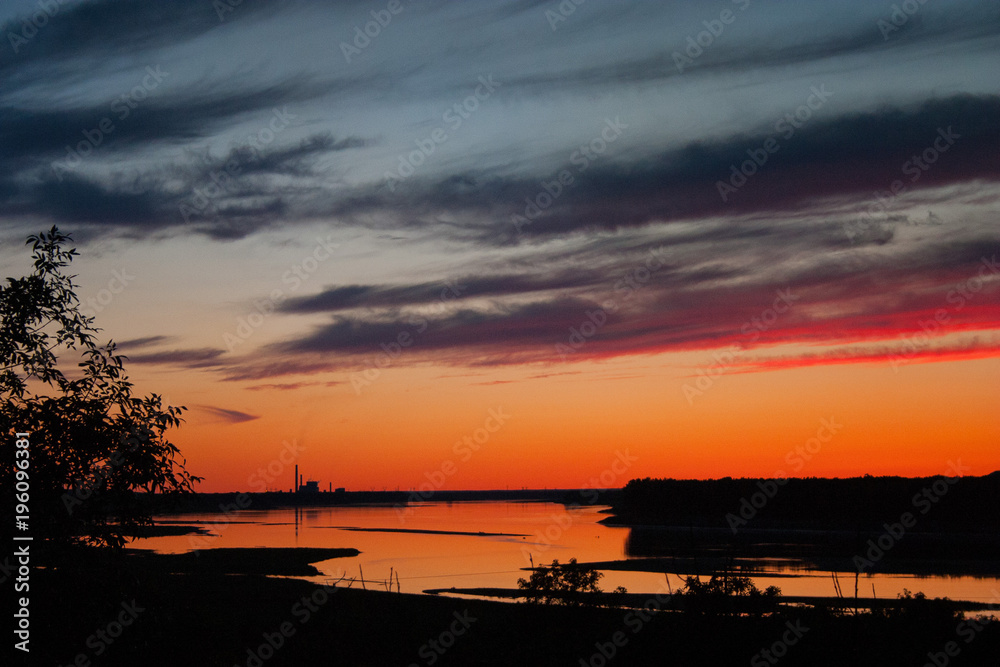 Naklejka premium Powerplants near Stanton reflected in the Missouri River after sunset