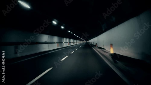 Driving in tunnel. Slow stright. photo