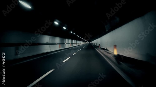 Driving in tunnel. Fast stright. photo