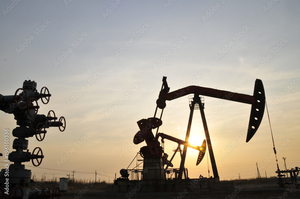 Drilling rig at sunset Drilling rig at sunset