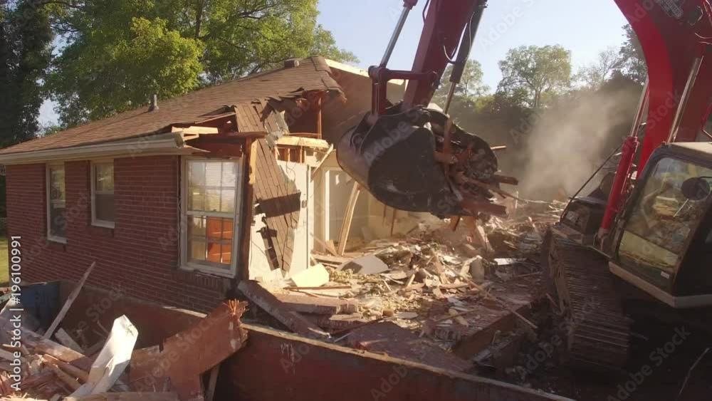 Close on Excavator Bucket Swinging Towards Camera