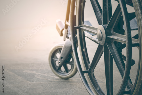 close up view of wheelchair with Pavement handicap symbol