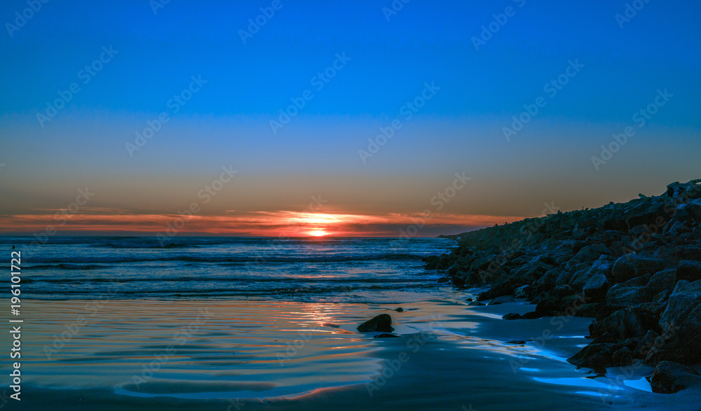 Ocean Sunset Along The Jetty