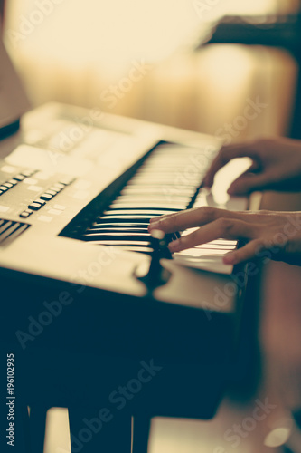 A musician performing on the keyboard