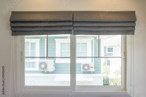 Grey curtain interior decoration in living room with sunlight photo