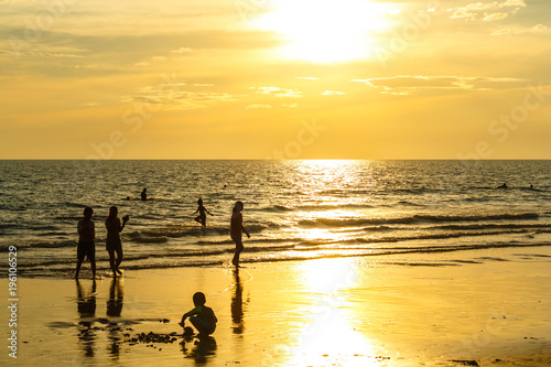 Sandy beach, golden sea, sunset © patboon