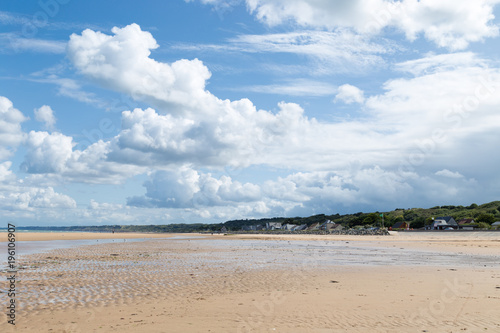 Omaha Beach - clouds beach and the coastline of one of the D-Day beaches of Normandy, France