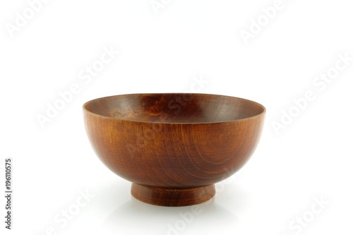 Wooden dishes bowls isolated on white background.