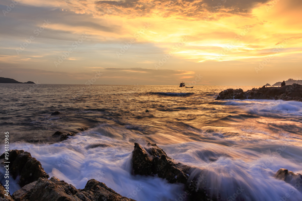 Seascape of wave on rock , Long Exposure at Sunset on the beach in Phuket Thailand. Seascape of wave on rock , Long Exposure at Sunset on the beach in Phuket Thailand.