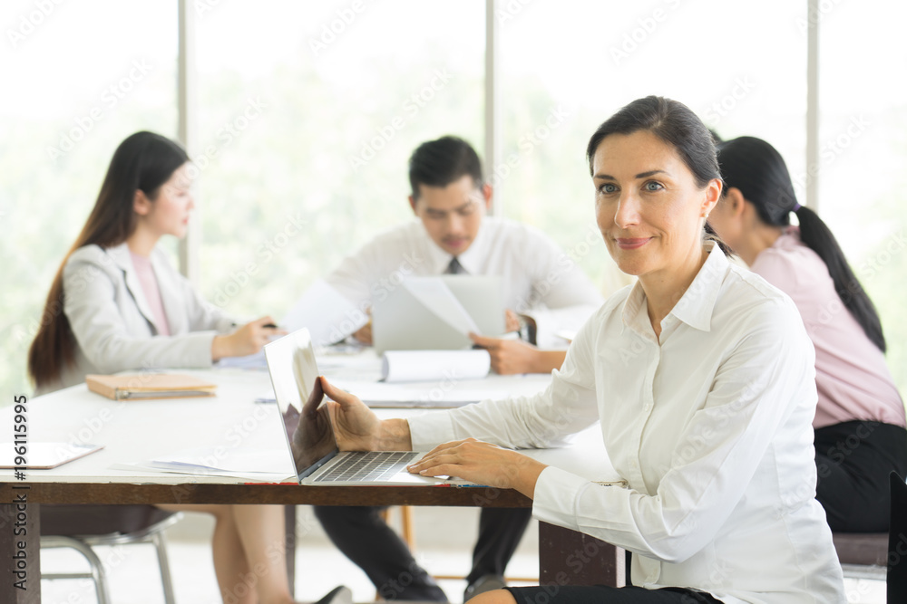 Happy Businesswoman Standing In Front Of meeting project. Happy Businesswoman Standing In Front Of meeting project.