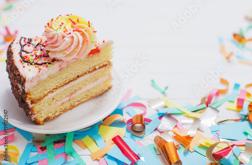 birthday cake and  decoration on white wooden background