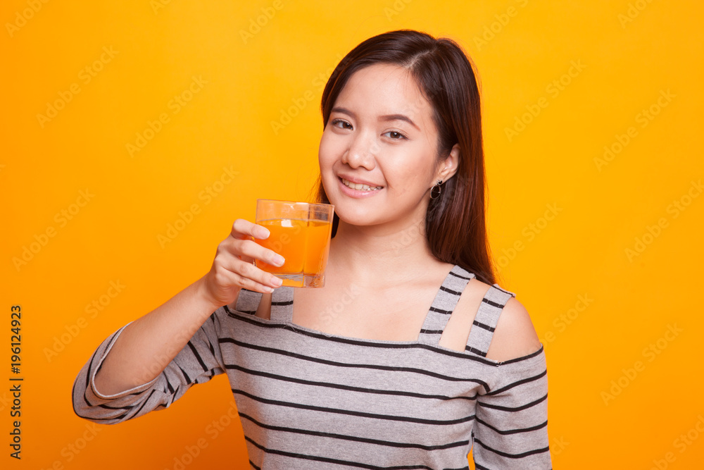 Young Asian woman drink orange juice. Young Asian woman drink orange juice.