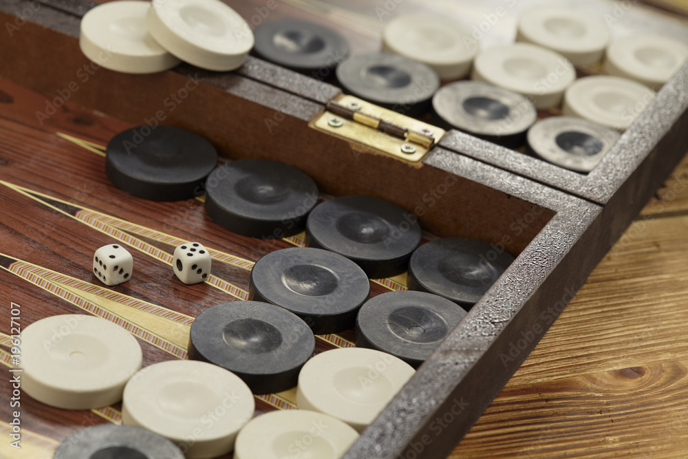 Color detail of a Backgammon game with two dice close up.
Color detail of a Backgammon game with two dice close up.