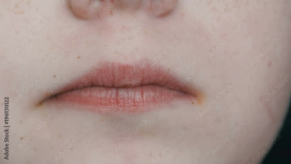 Mouth of teenager boy eat potato chips close-up view Mouth of teenager boy eat potato chips close-up view