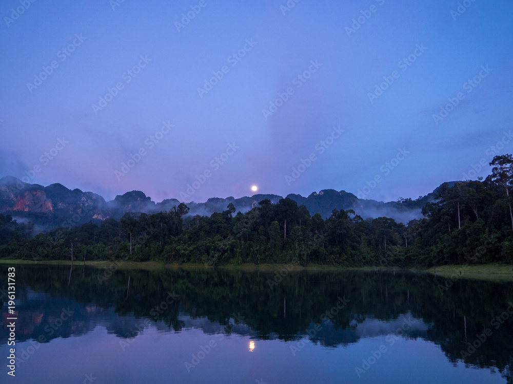 Moon Rise Purple Blue Sky Reflection Over Lake in Thailand