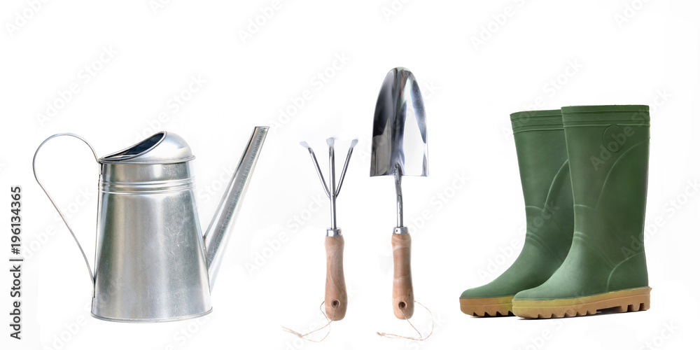 watering can, gardening tools and rubber boots on white background watering can, gardening tools and rubber boots on white background