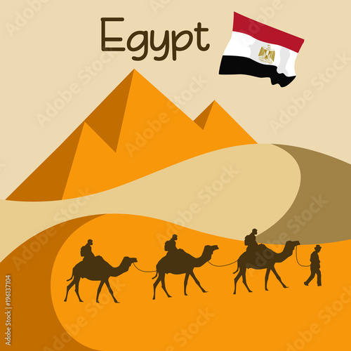 Caravan of camels in sand dune in Egypt near great pyramids