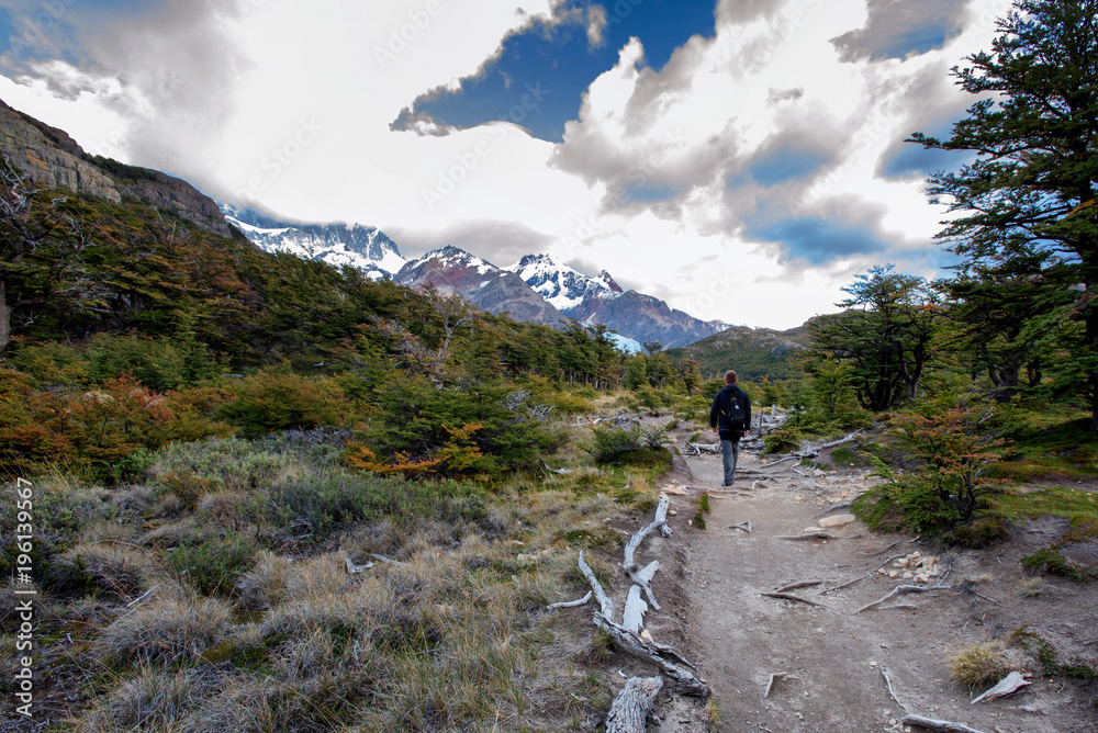 Man hiking trail towards Mount Fitz Roy in Patagonia in Argentina