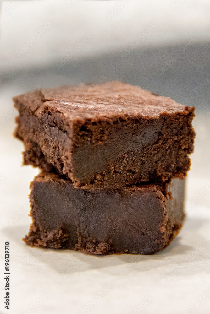 Stack of two dark chocolate chewy brownies Stack of two dark chocolate chewy brownies