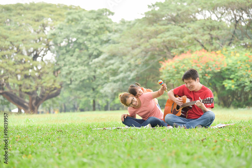 Happy Asian family having fun. © eggeeggjiew