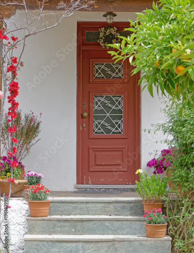 Fototapeta Naklejka Na Ścianę i Meble -  Athens Greece, vintage house entrance with flowers and plants