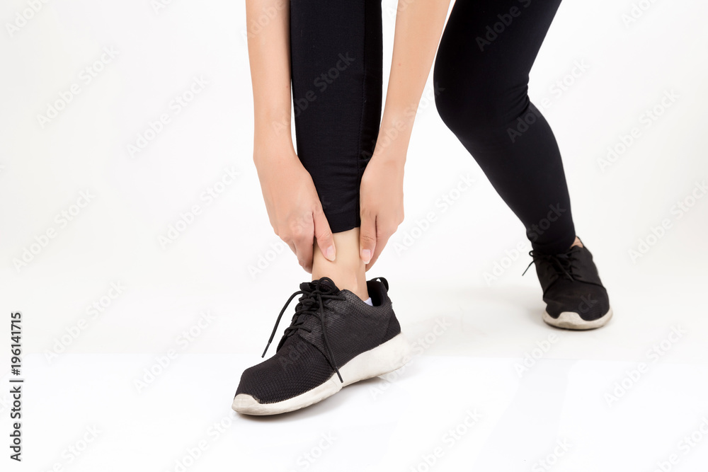 Woman with leg feeling pain. Studio shot on white background. Fitness and health concept Woman with leg feeling pain. Studio shot on white background. Fitness and health concept