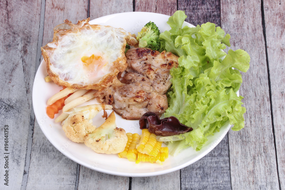 Chicken steak and grilled mixed vegetables . Chicken steak and grilled mixed vegetables .