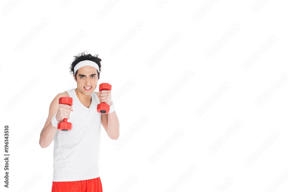Young skinny man in sportswear holding dumbbels isolated on white Young skinny man in sportswear holding dumbbels isolated on white