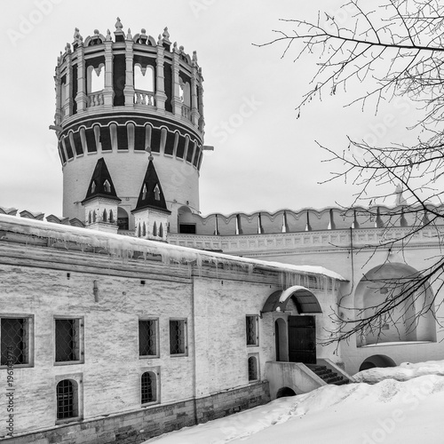 Novodevichiy convent. Winter day in Moscow, Russia. The chamber of the princess Sophia. Nadprudnaya tower. Wall of the Novodevichy Convent. Black and white photograph of Russian religious architecture photo