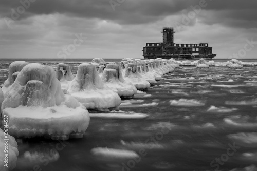 Frozen Baltic sea and ruins old military building in Babie Doly, Gdynia, Poland photo