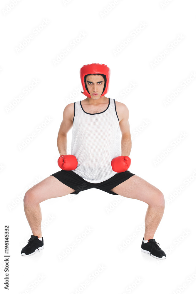 Thin sportsman in boxing helmet and gloves standing isolated on white Thin sportsman in boxing helmet and gloves standing isolated on white