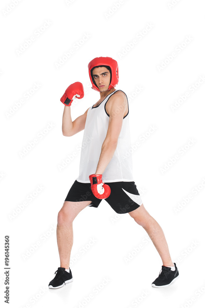Thin sportsman in boxing gloves and helmet standing isolated on white