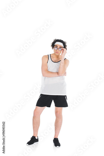 Skinny sportsman taking off eyeglasses isolated on white