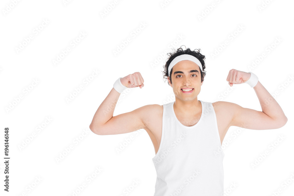 Young thin man in singlet showing muscles isolated on white Young thin man in singlet showing muscles isolated on white