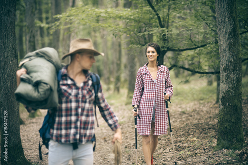 Man with woman hiking with overnight stay or picnic.