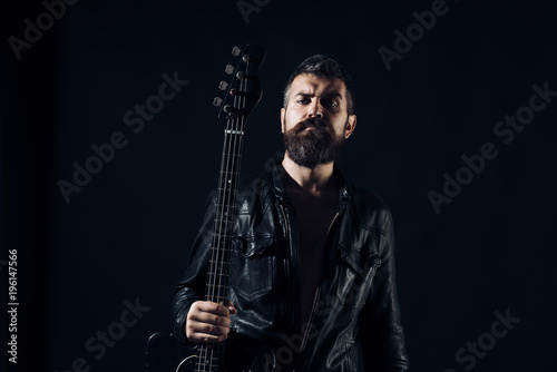 Young bearded man with electric guitar