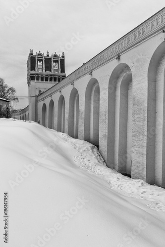 Novodevichiy convent. Winter day in Moscow, Russia. Wall of the Novodevichy Convent. Savvinskaya Tower photo