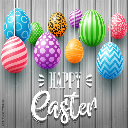 Colorful easter eggs decorated on a wooden background