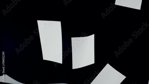 Blank paper sheets falling down