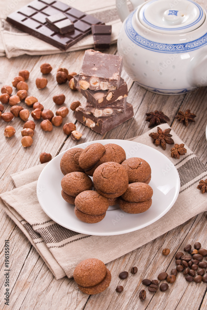 Hazelnut shortbread sandwiches filled with chocolate cream.