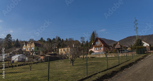 Path near Lovos hill in north Bohemia with houses