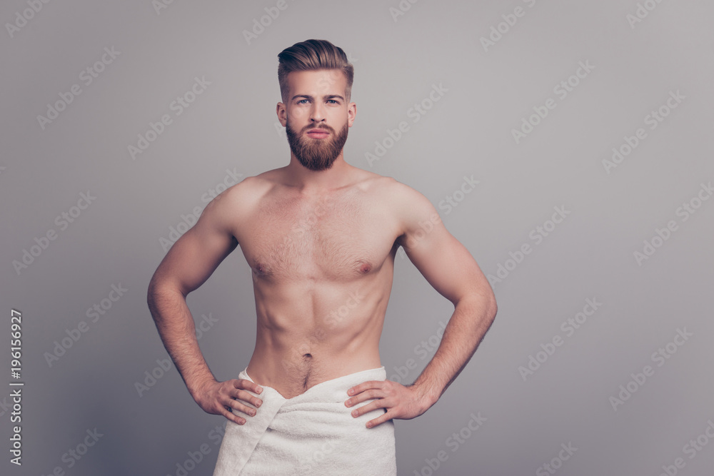 Portrait of confident serious handsome brutal sporty sportive muscular masculine self-assured proud respect neat macho holding keeping hands on hips isolated on gray background copy-space
