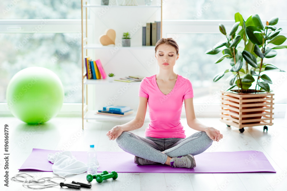 Hobby figure stretching trainer equipment fit-ball plant concept. Healthy pretty concentrated focused charming pretty beautiful woman sitting in lotus position closed eyes on the floor in club Hobby figure stretching trainer equipment fit-ball plant concept. Healthy pretty concentrated focused charming pretty beautiful woman sitting in lotus position closed eyes on the floor in club