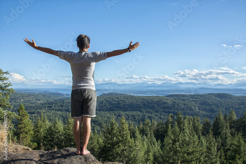 Young man at  Chinese mountain in Quadra Island, BC. photo